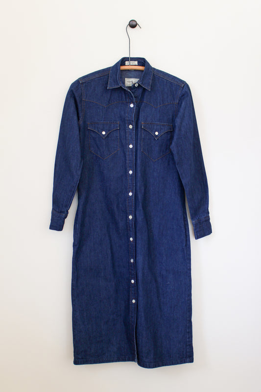 Blue denim dress on a hanger against a white background