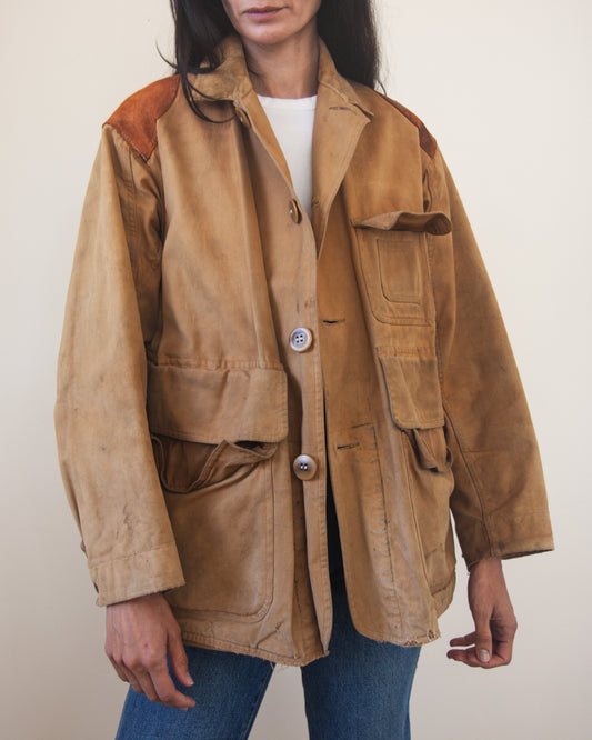 Person wearing a brown jacket with a white background
