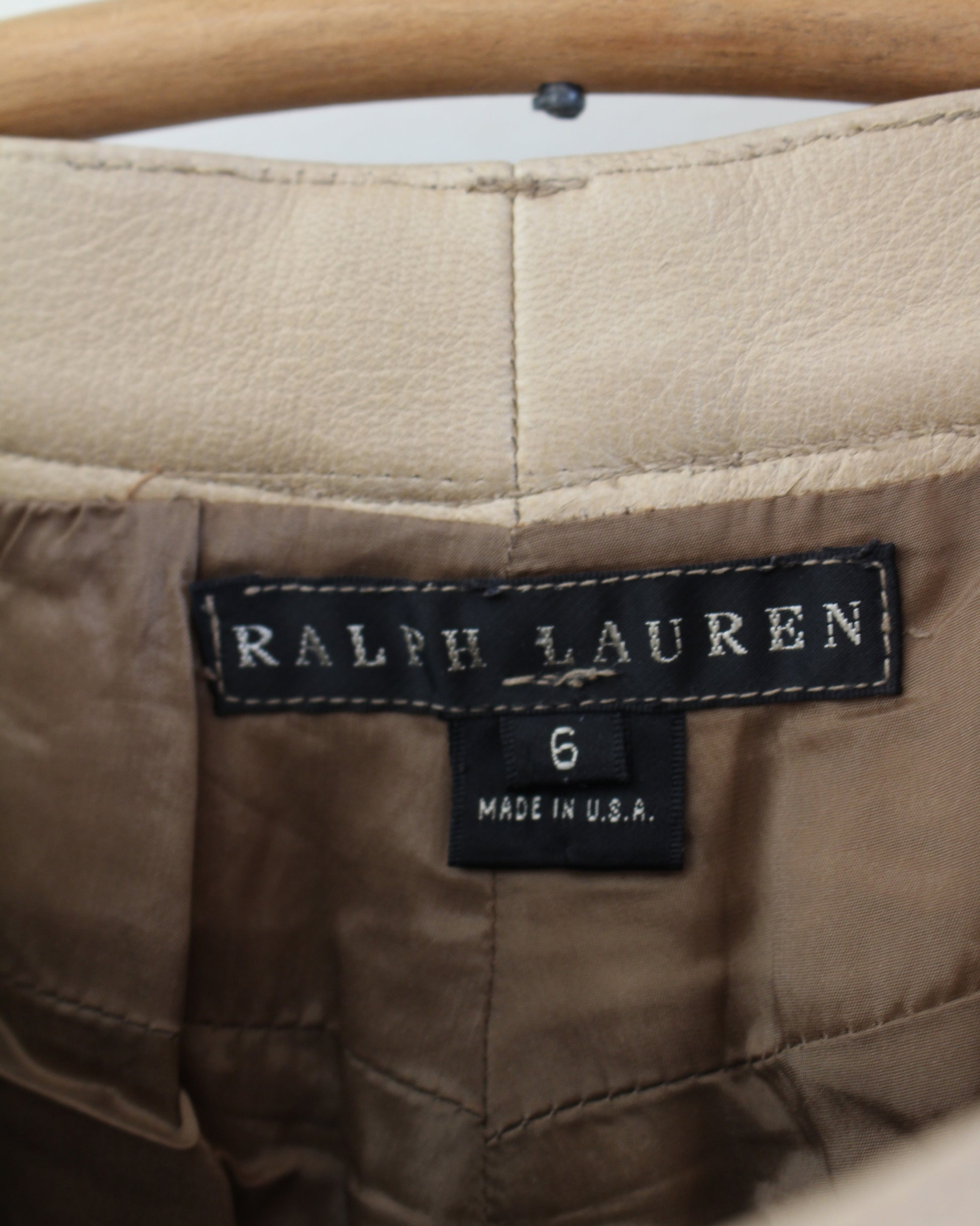 Ralph Lauren label on a brown garment with wooden handle