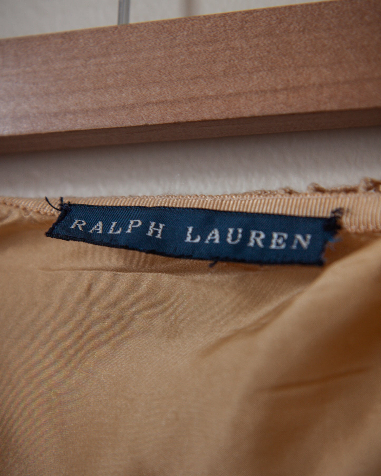 Ralph Lauren label on a brown fabric background