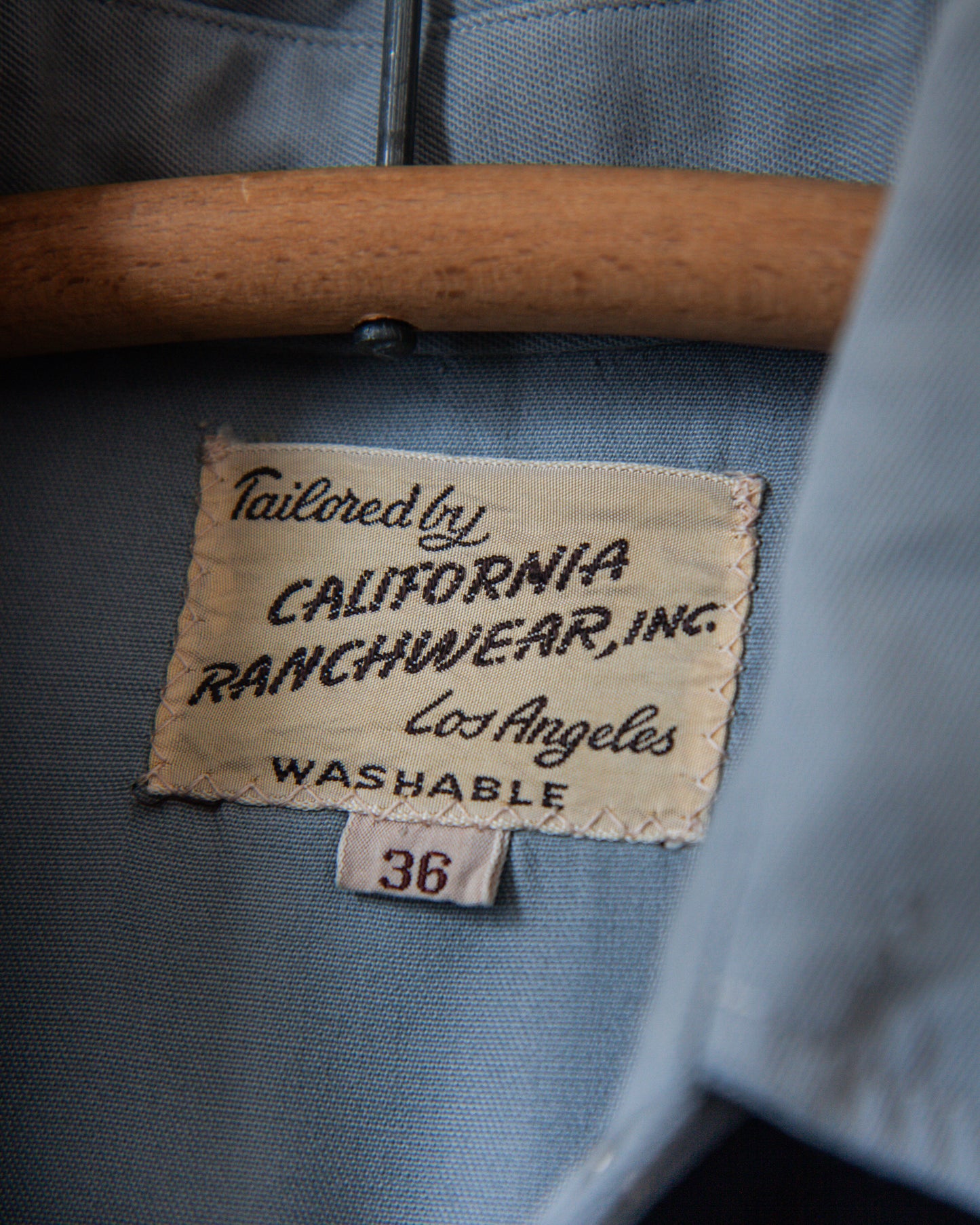 Label on a garment with 'Tailored by California Ranchwear, Inc.' text