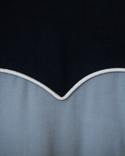 Close-up of a black and blue fabric with a white edge