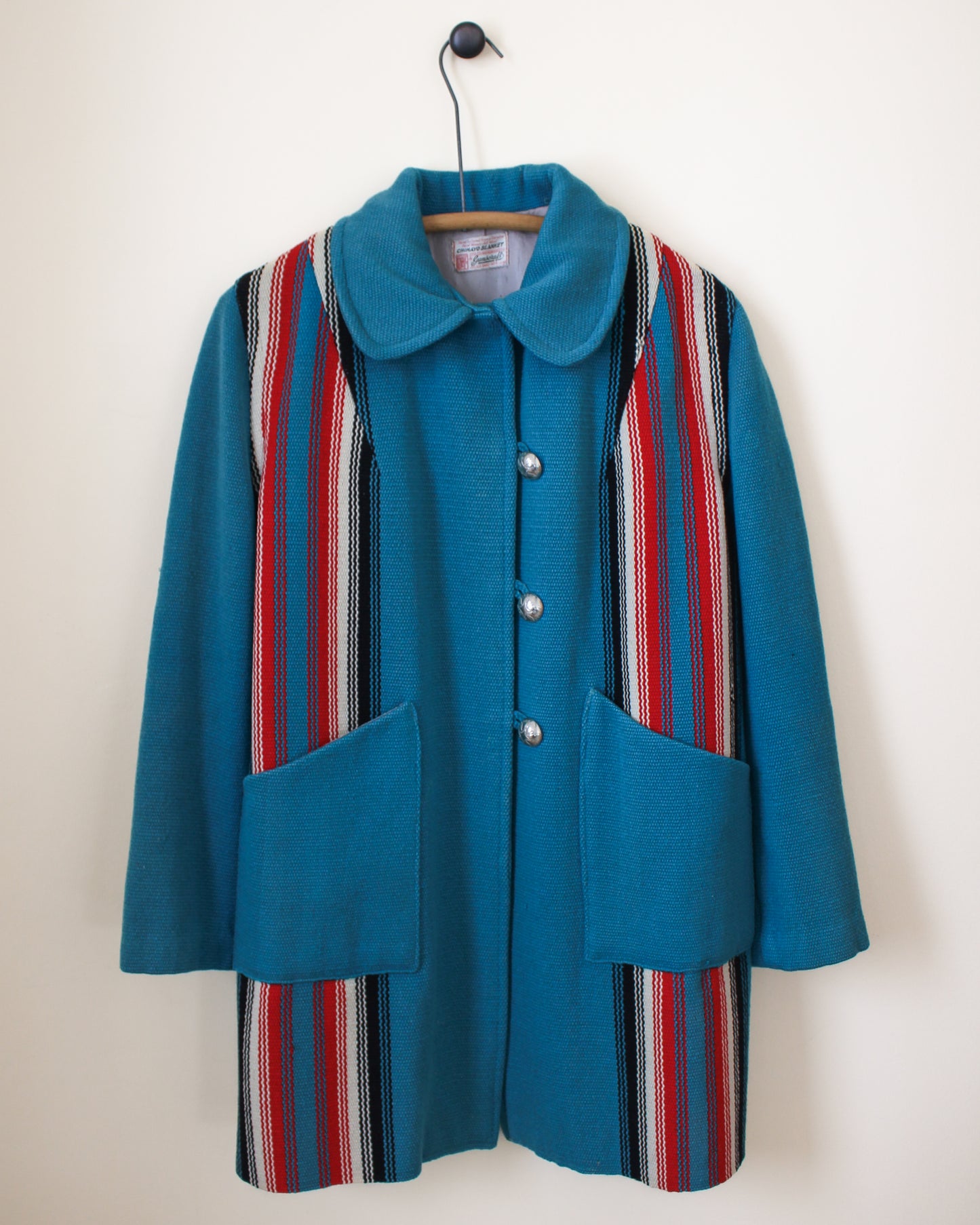Blue coat with striped pattern on a white background