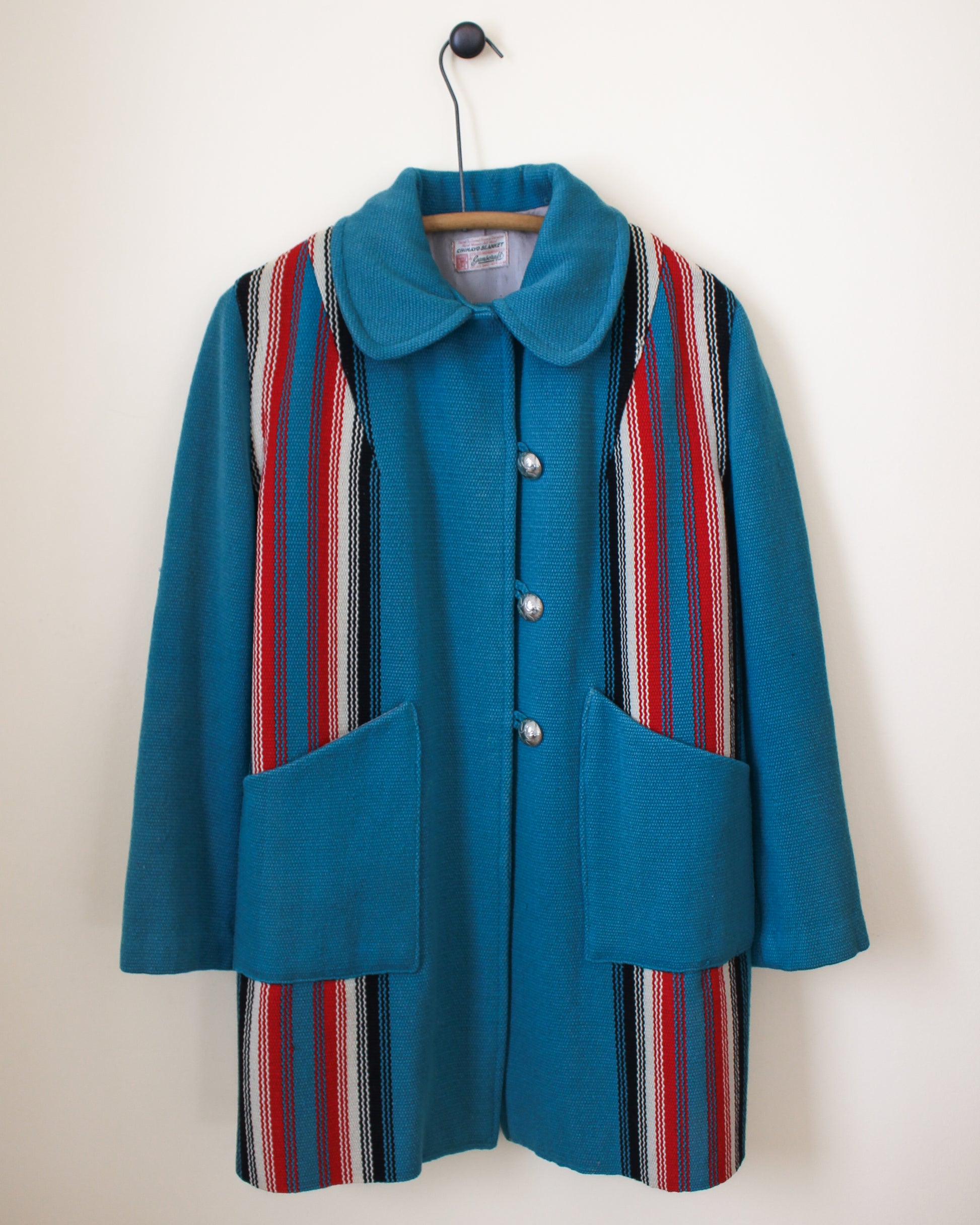 Blue coat with striped pattern on a white background
