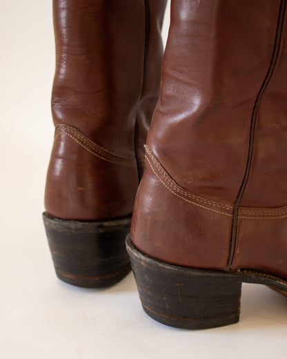 Close-up of brown leather boots on a white background