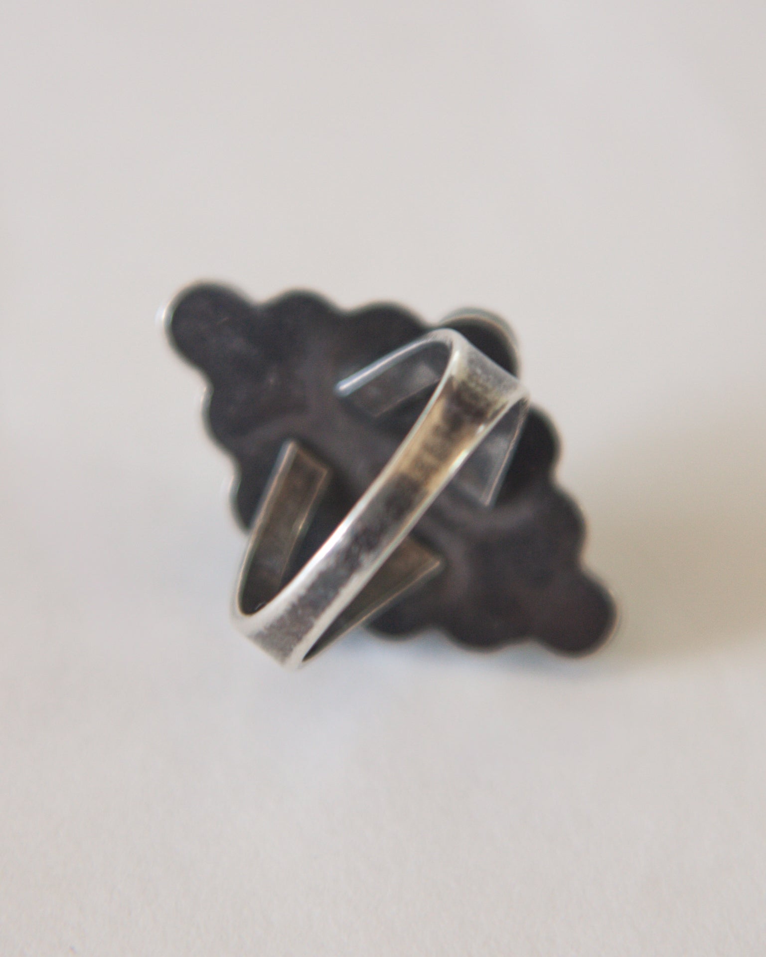 Silver ring on a white background