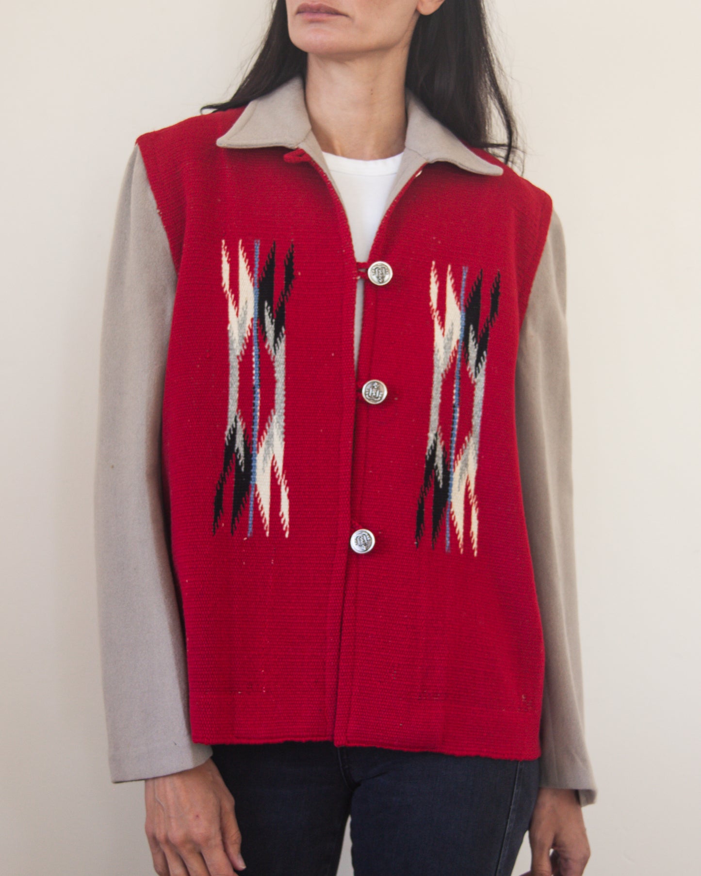 Red patterned jacket worn by a person on a plain background
