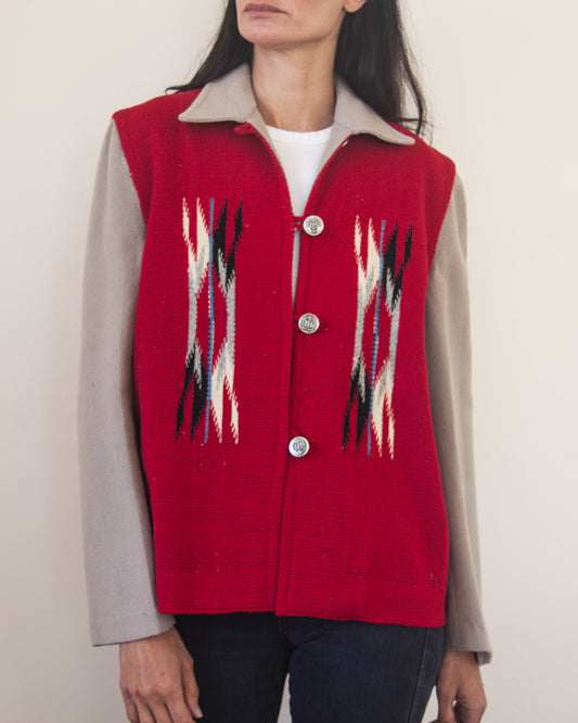 Red patterned jacket worn by a person on a plain background