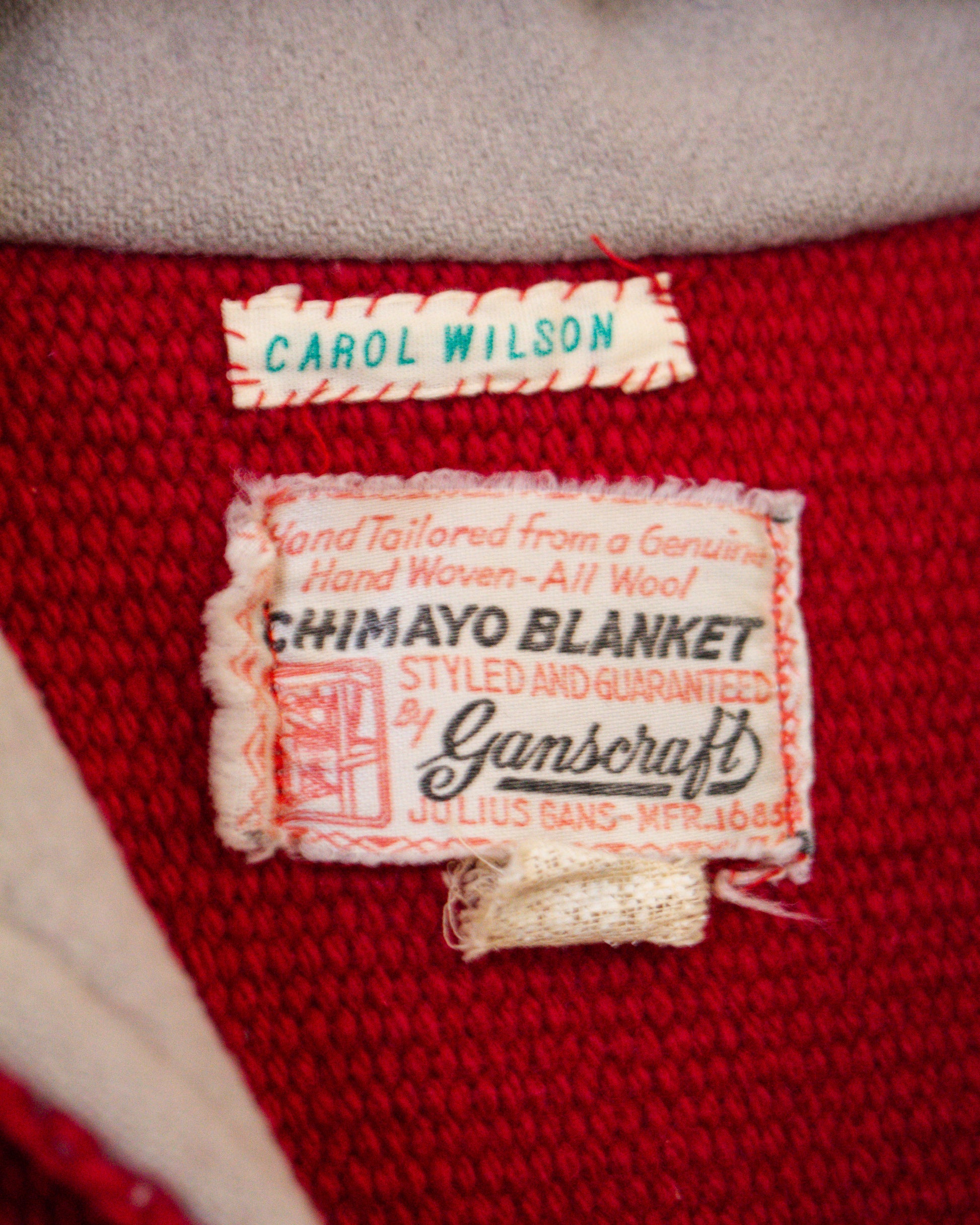 Label on a red jacket with 'Carol Wilson' and 'Ganscraft' branding.