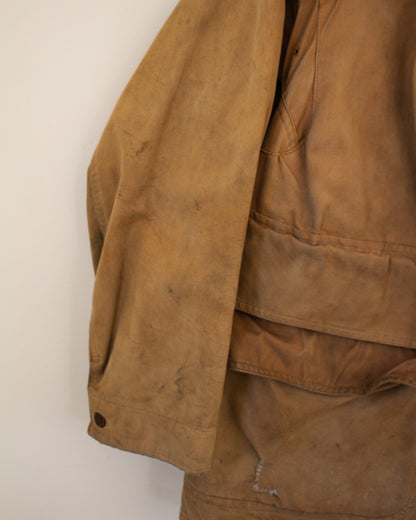 Close up of sleeve flaw on brown jacket