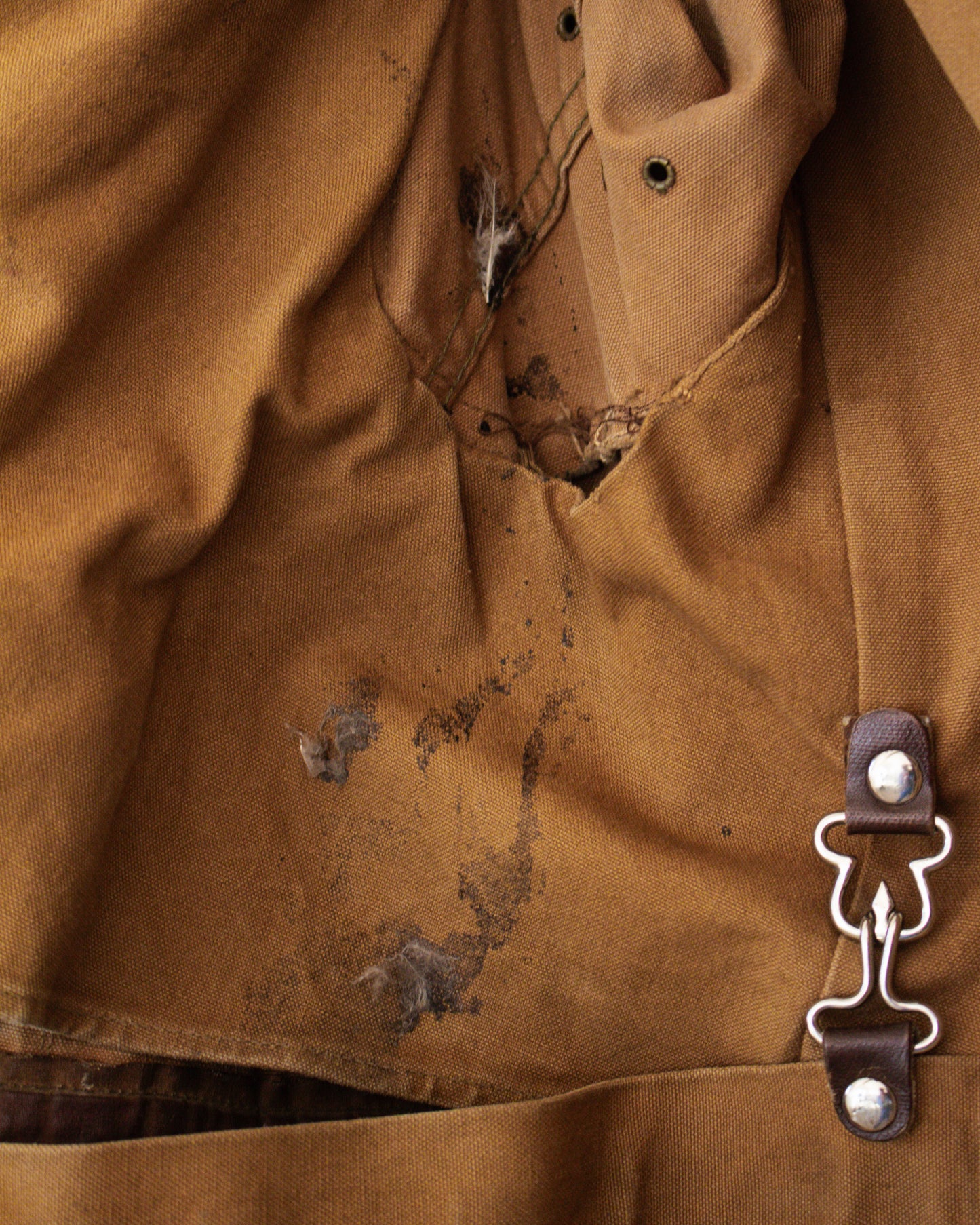 Stains and tear on jacket