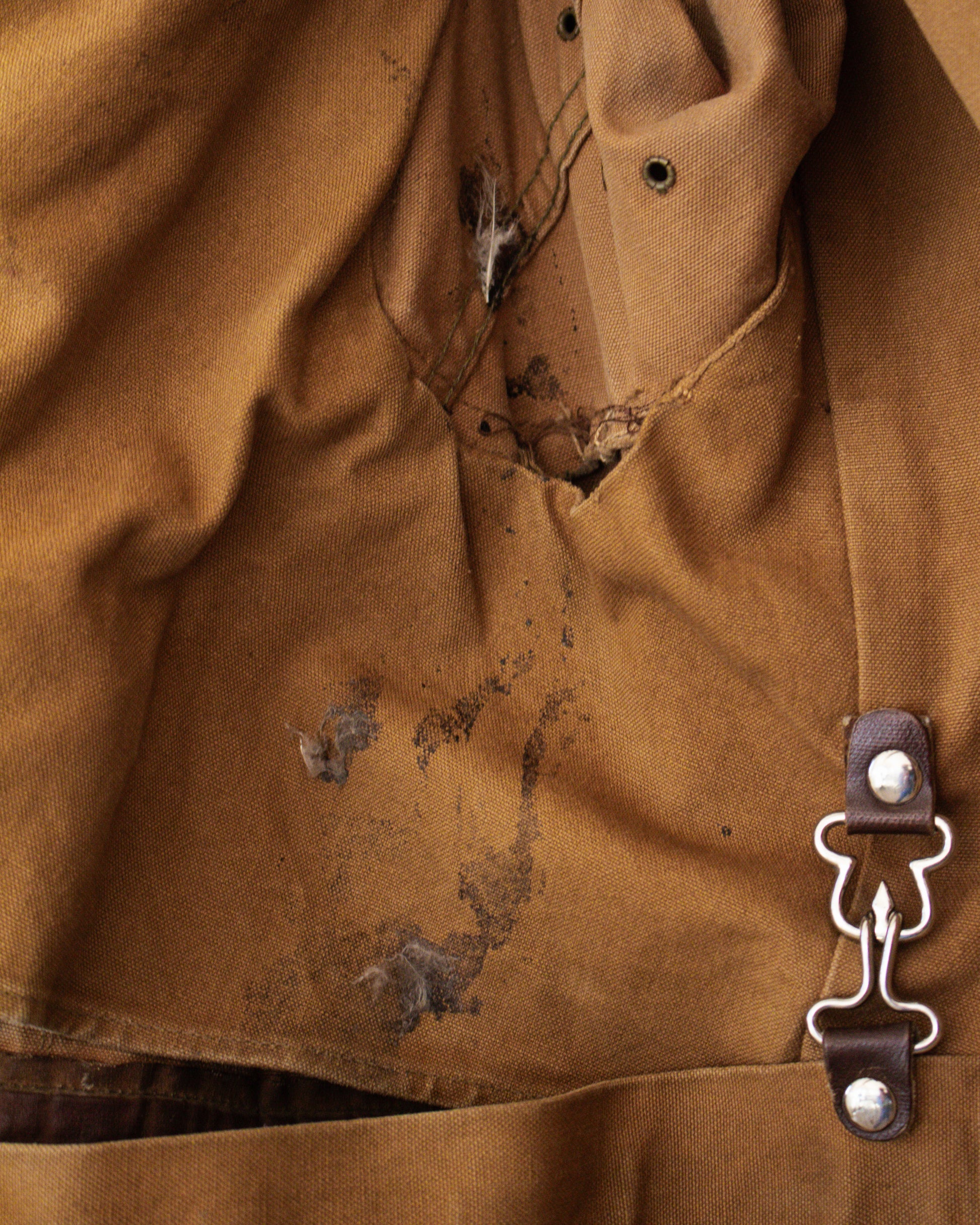 Stains and tear on jacket