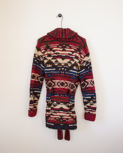Colorful patterned jacket on a hanger against a white background - back view