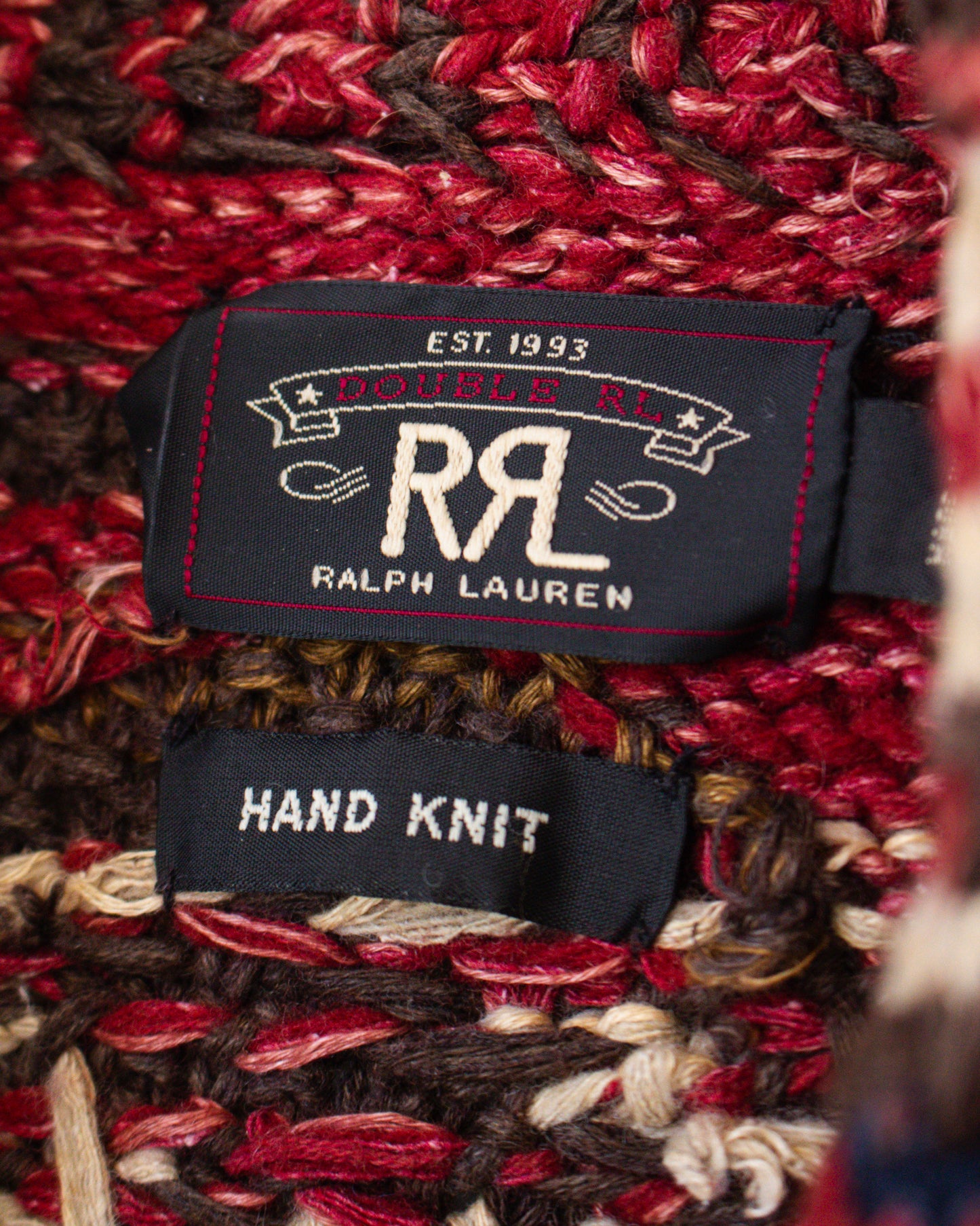Ralph Lauren label on a hand-knit fabric with red and brown patterns
