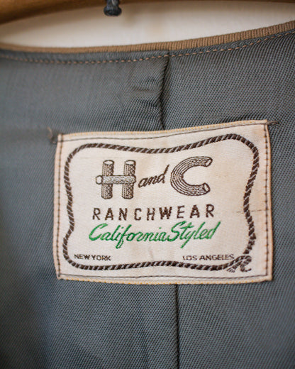 Label on a gray fabric with 'H & C Ranchwear' branding