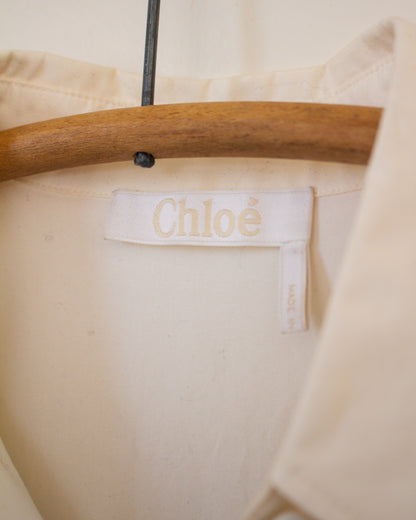 White blouse garment with Chloe label on a hanger