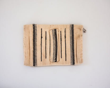 Back view of cream wool Chimayo clutch with hand strap in back. Gray and brown stripes. 