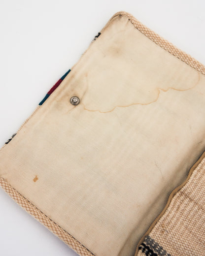 Stains on interior flap of clutch. 