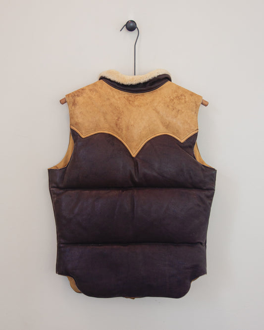 Back of down leather vest on a hanger