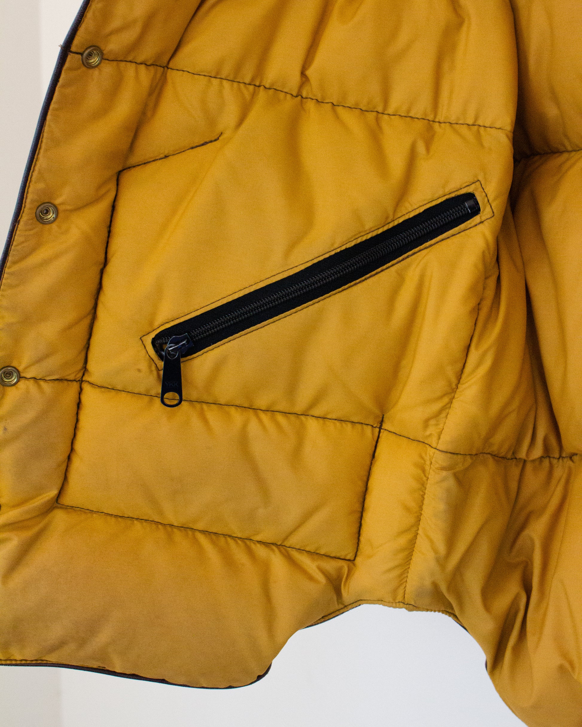 Inside pocket of yellow-lined vest