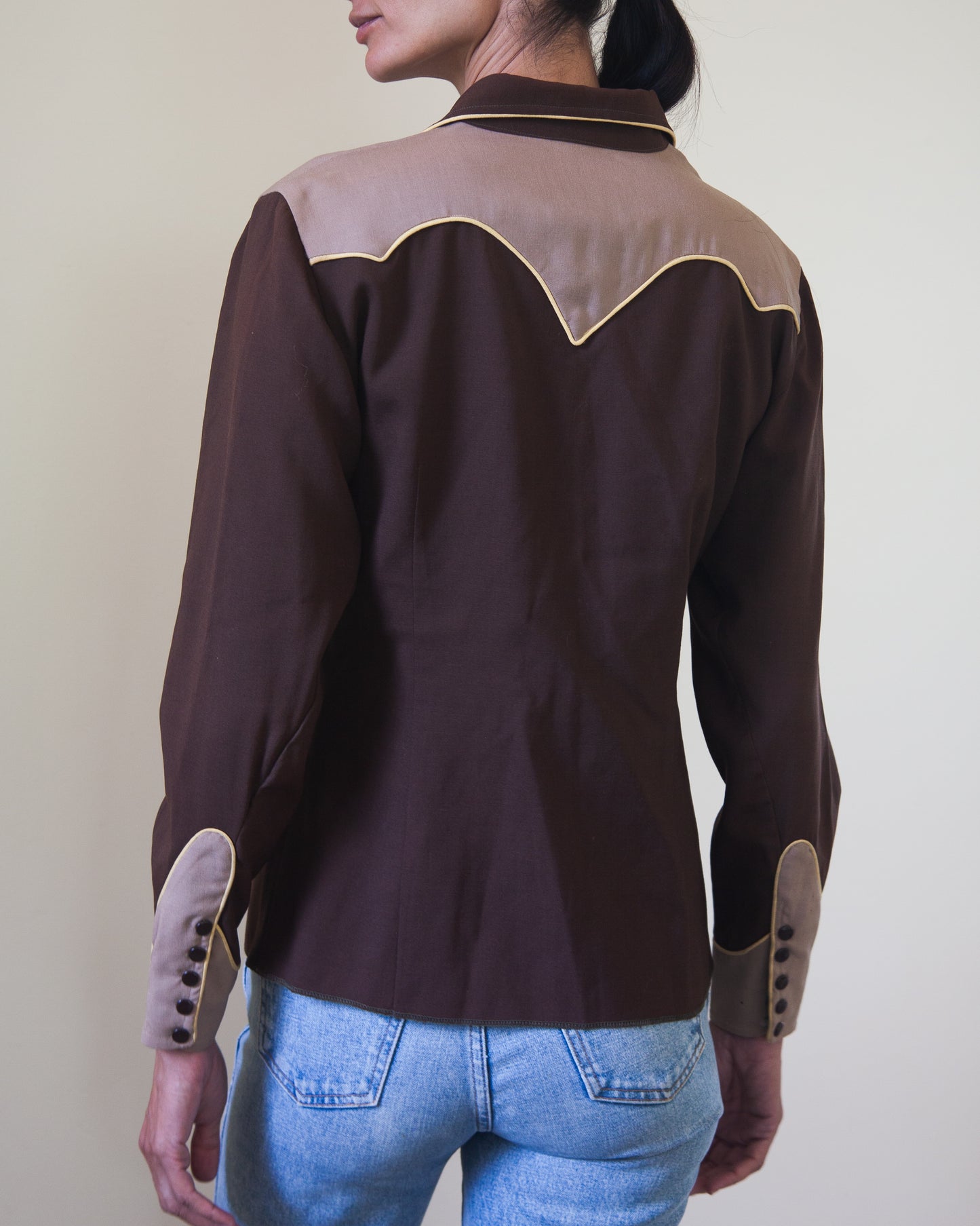 Back of woman wearing Western shirt with smile pockets