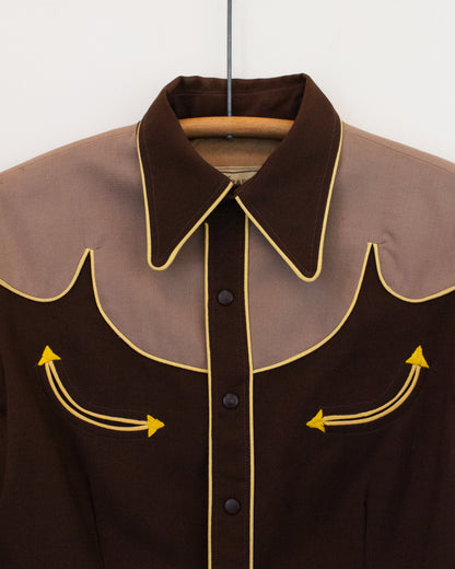 Close up of brown and tan shirt with yellow trim