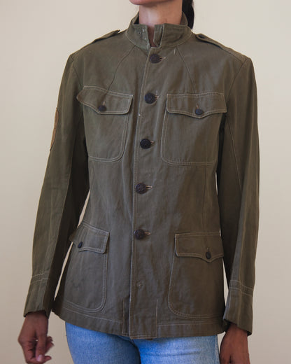Woman wearing military jacket buttoned up