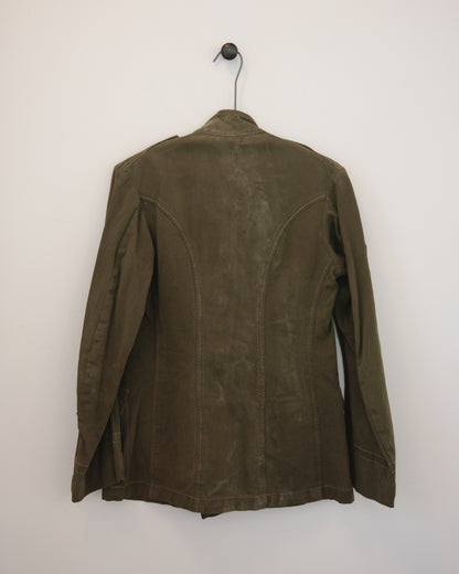 Back side of military jacket on hanger