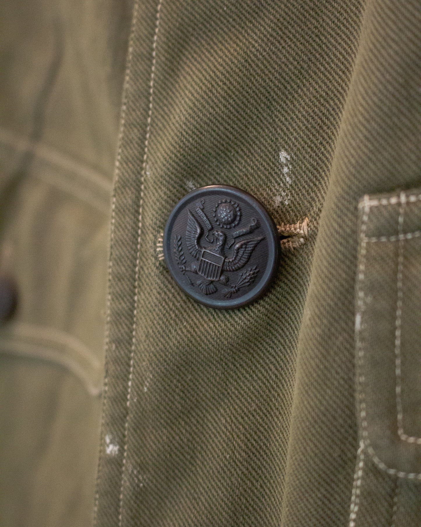 Close up view of button on military jacket