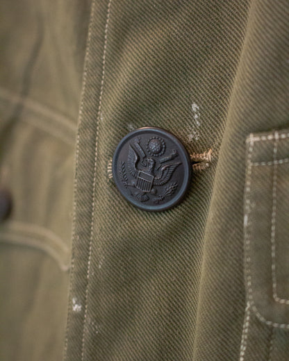 Close up view of button on military jacket