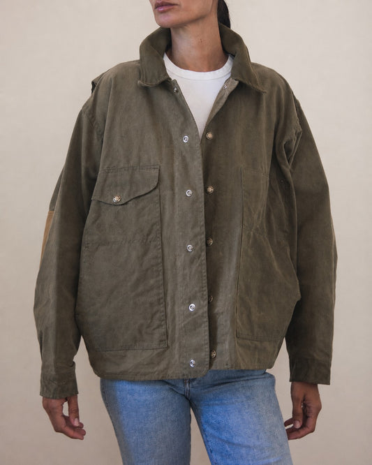 Woman wearing oversized olive green jacket