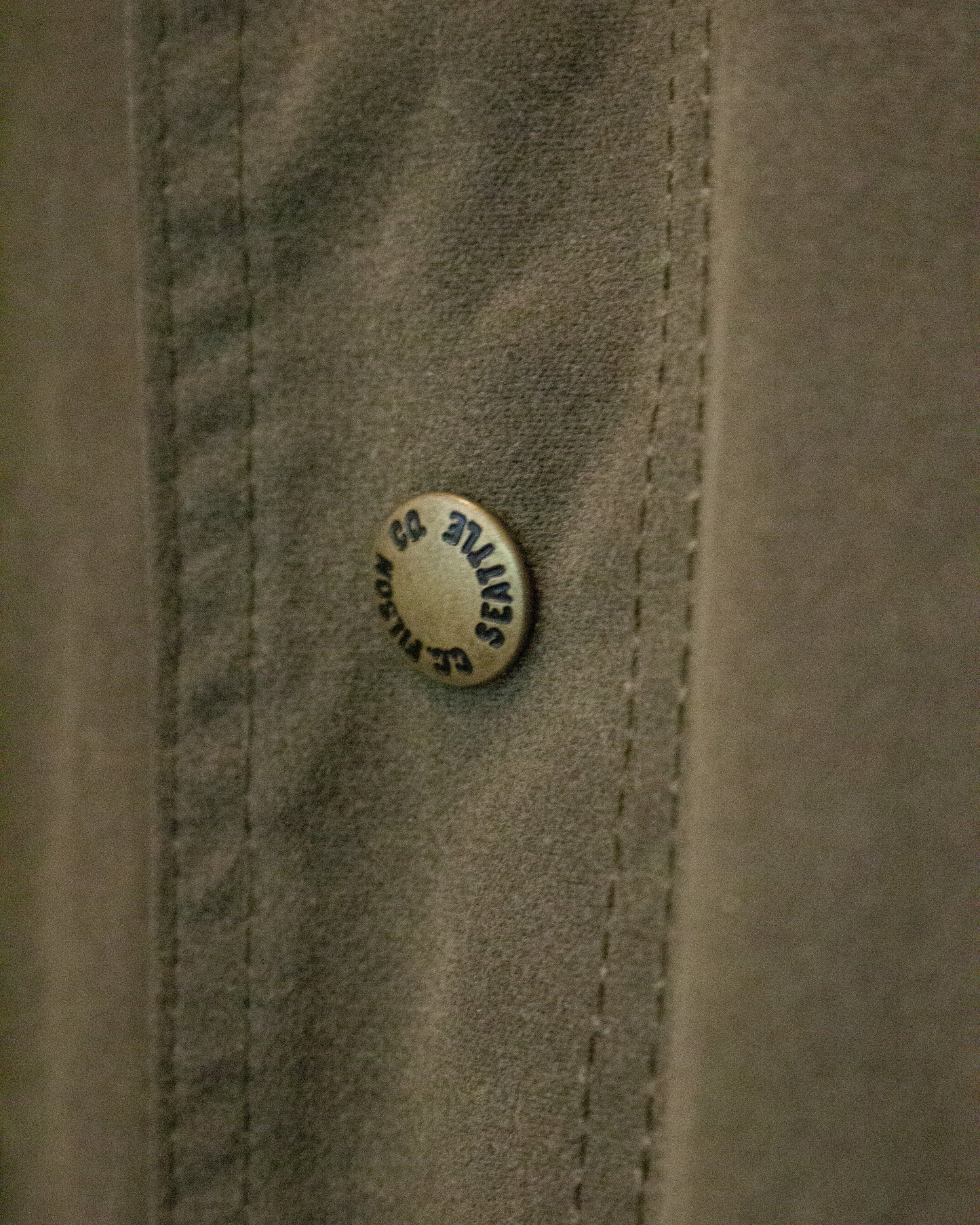 Close up of Filson Co Seattle button