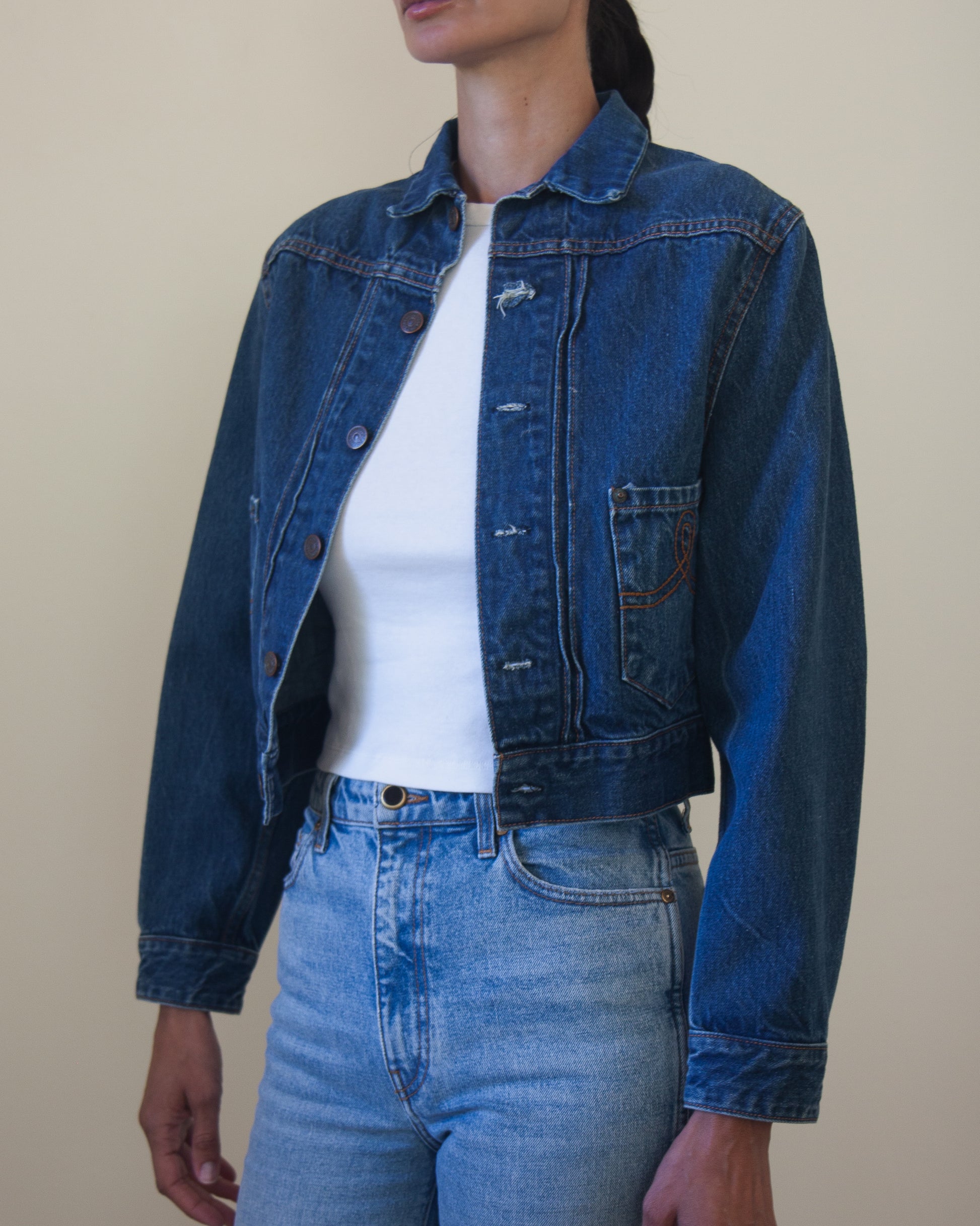 Woman wearing denim jacket with white t-shirt