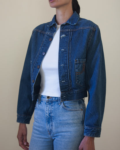 Woman wearing denim jacket with white t-shirt