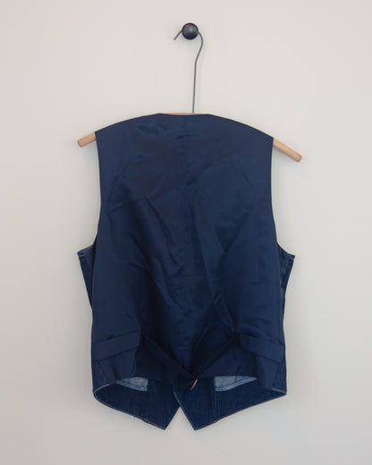 Back view of denim vest on hanger