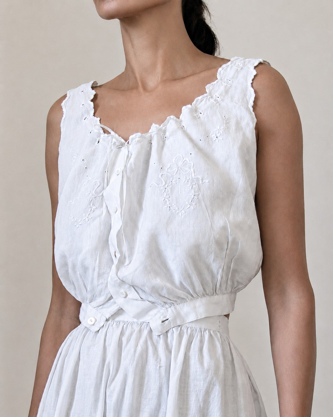 Woman wearing white corset cover and skirt