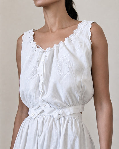 Woman wearing white corset cover and skirt