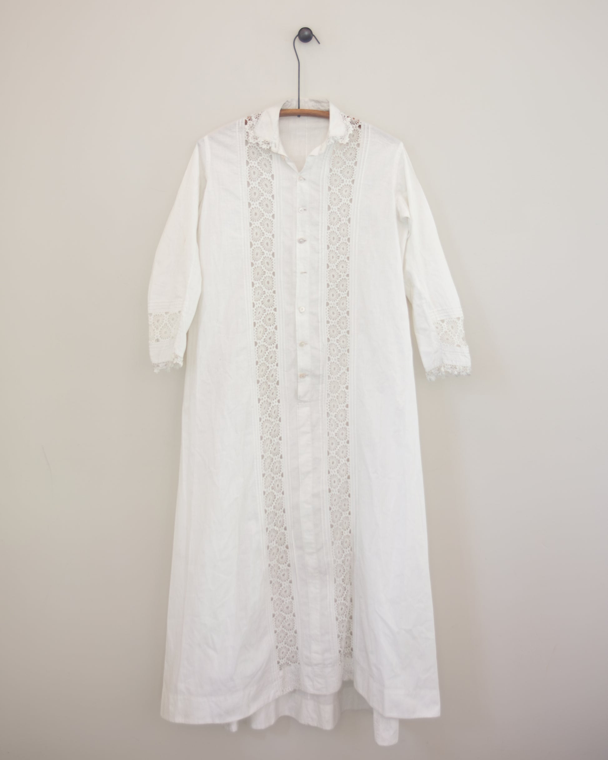 White dress with lace detailing on hanger