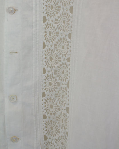 Close up of white dress with lace detailing