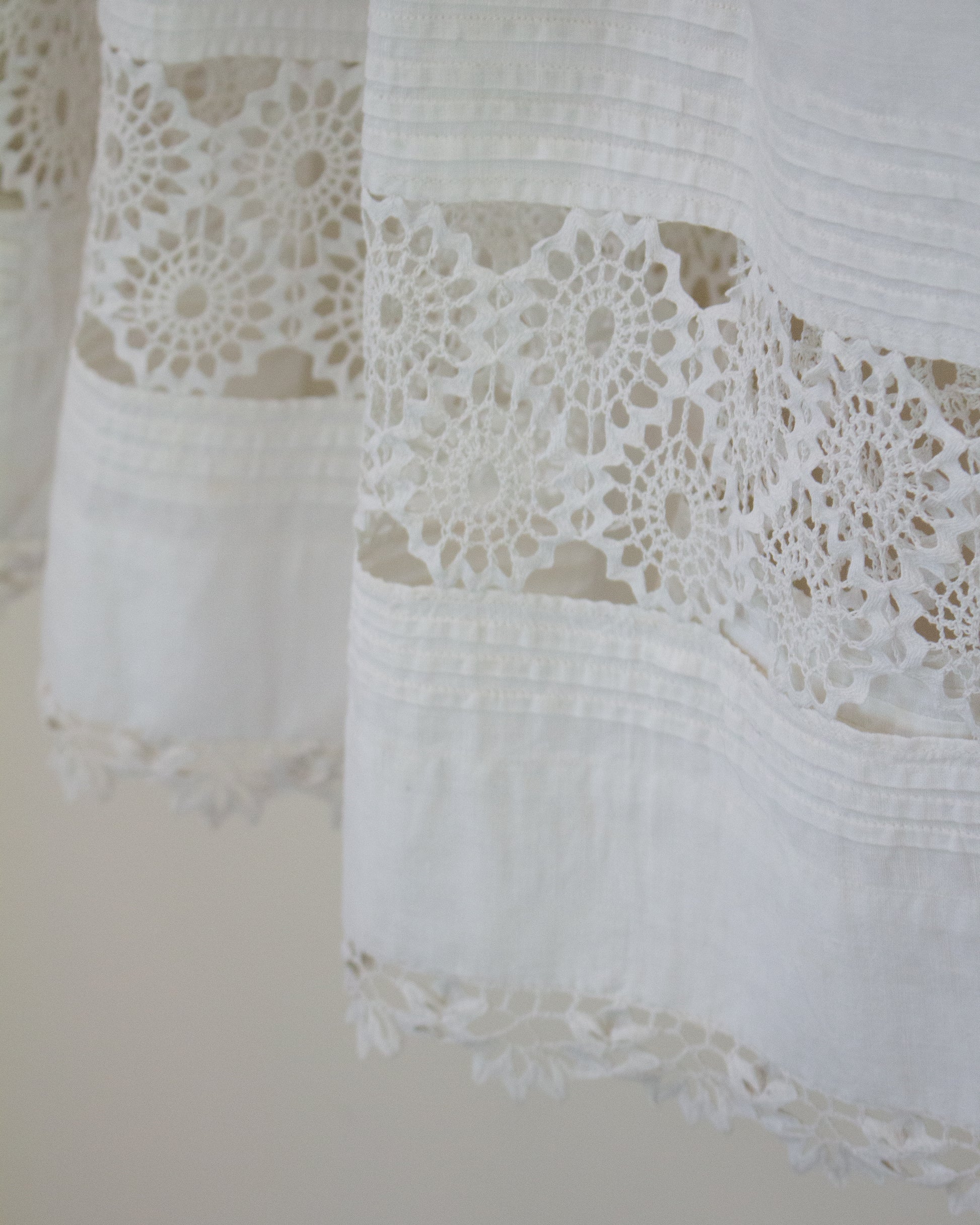 Lace detailing at hem of skirt