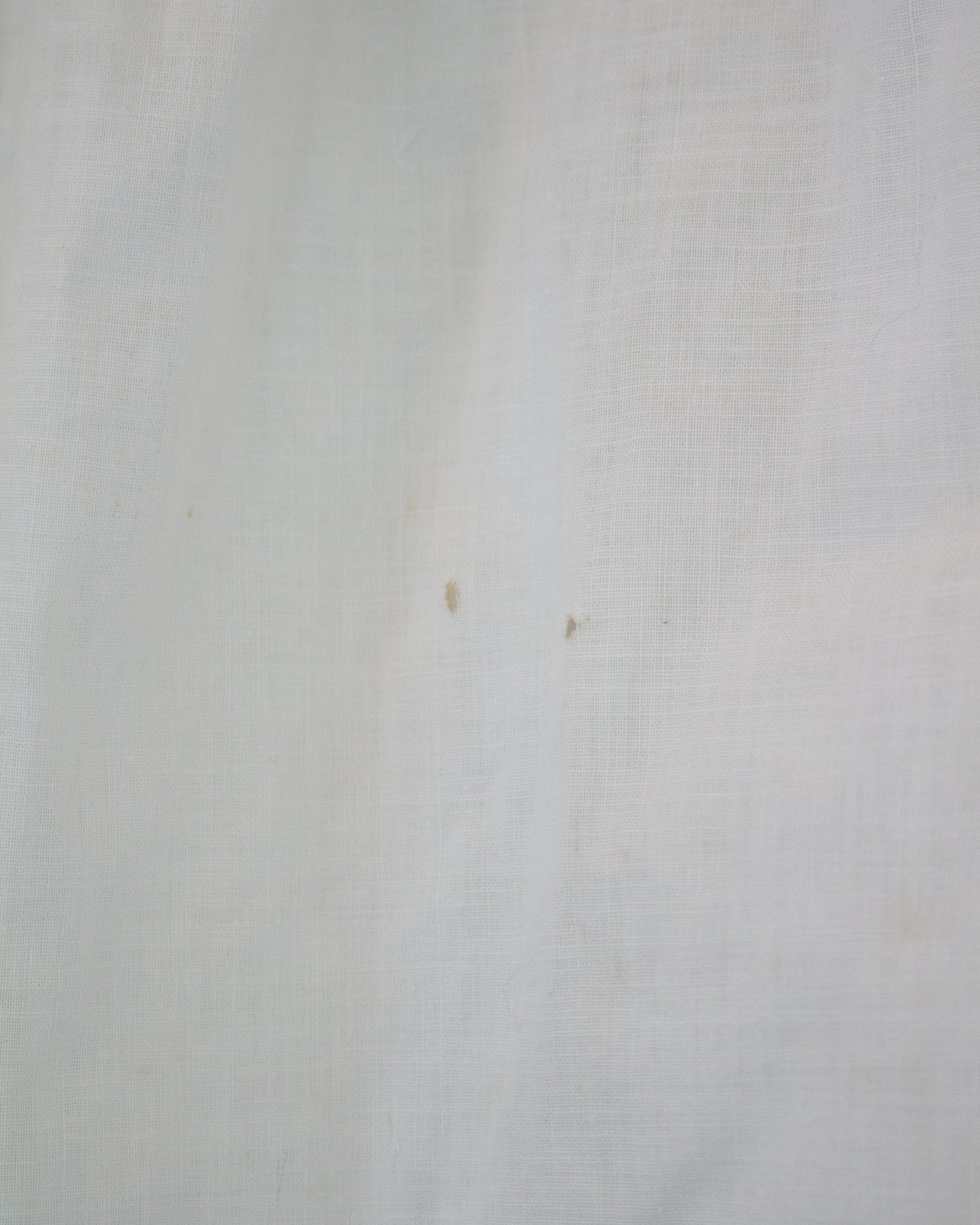Two small marks on white background