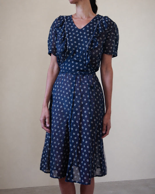 Woman wearing blue and white dress