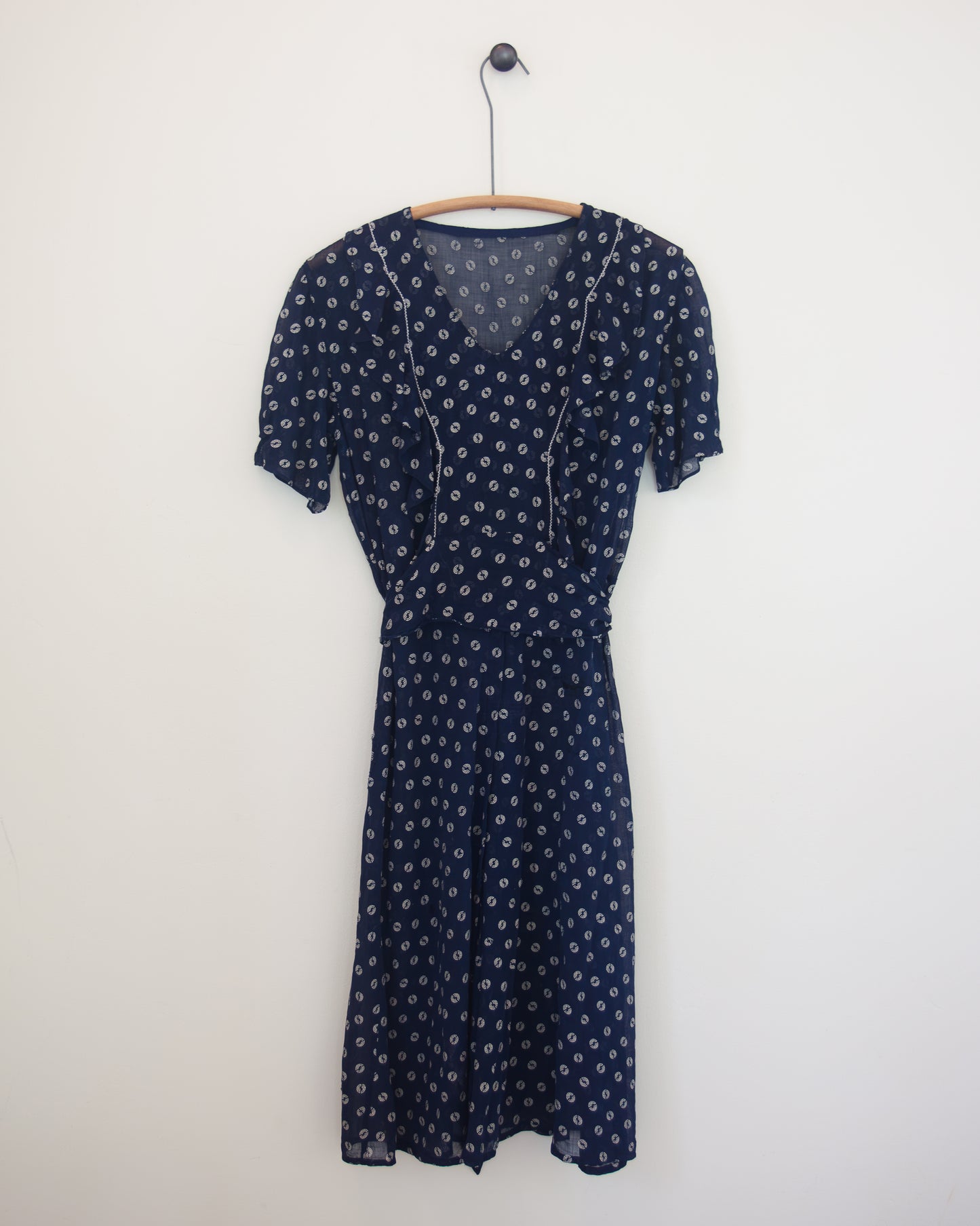 Blue and white dress on hanger