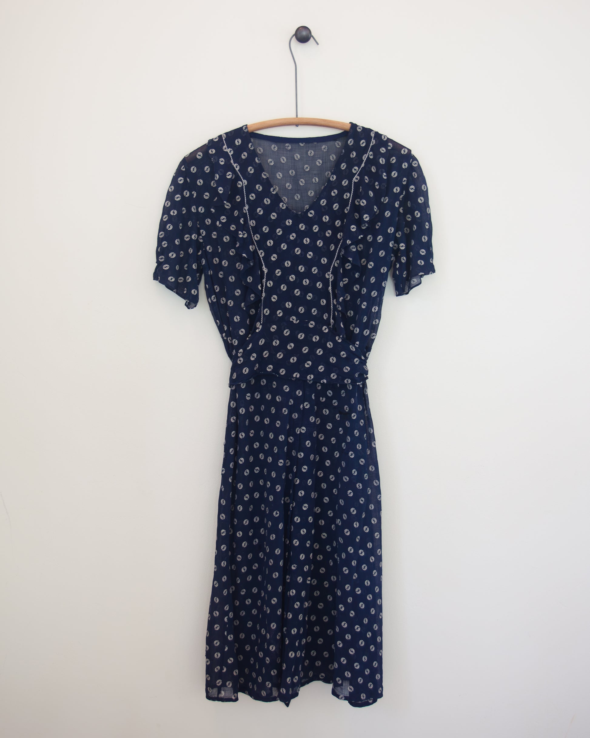 Blue and white dress on hanger