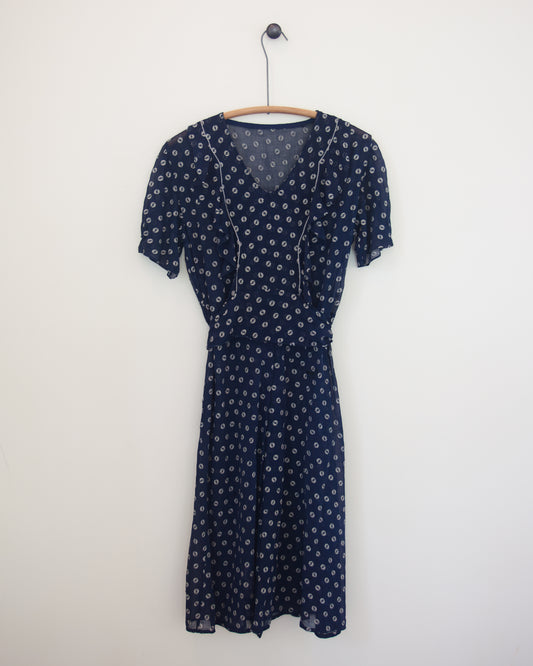 Blue and white dress on hanger