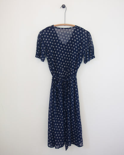 Back of blue and white dress on hanger
