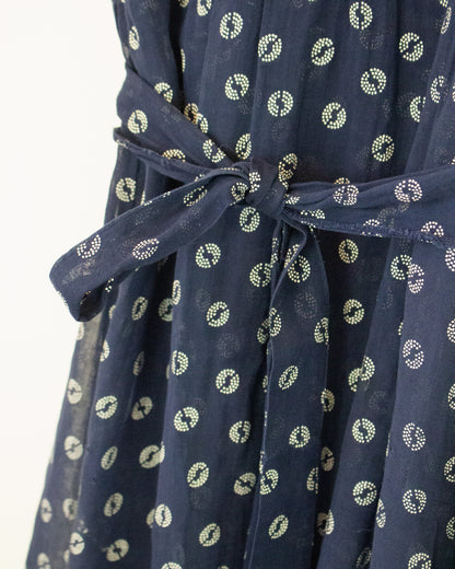Close up view of tie on blue and white dress
