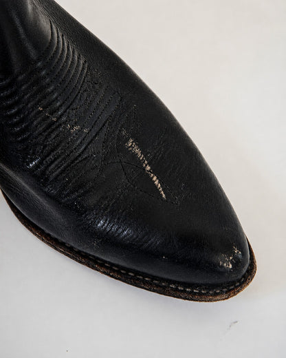 Scuffs on toe of cowboy boot