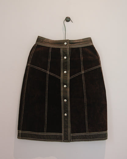 Brown leather skirt on hanger