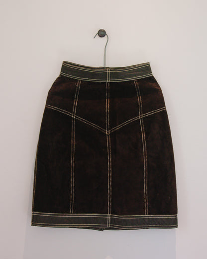 Back view of brown leather skirt on hanger 
